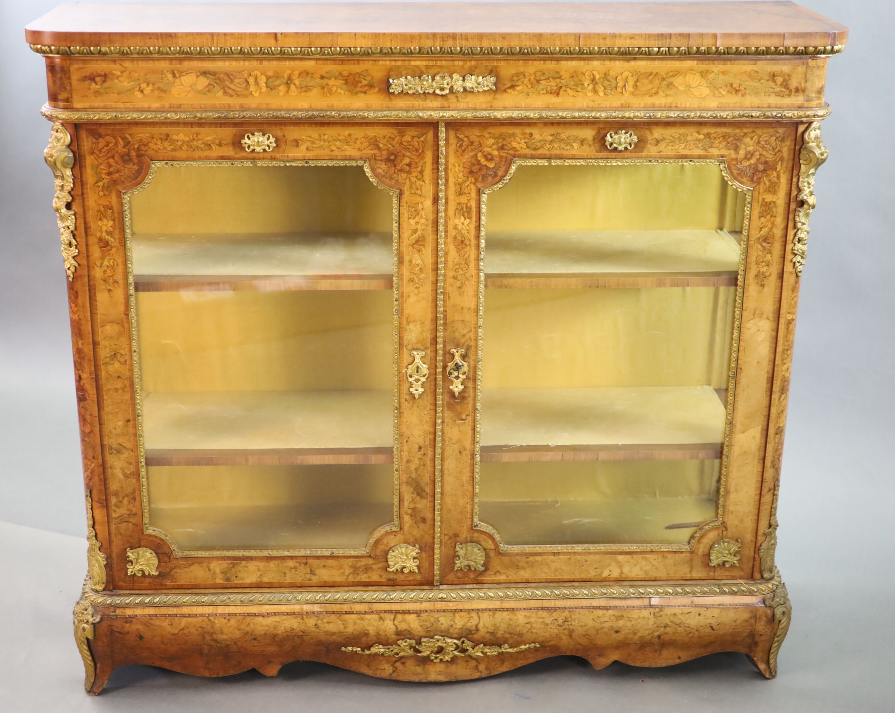 A Victorian ormolu mounted marquetry inlaid walnut bookcase, W.126cm D.38cm H.115cm